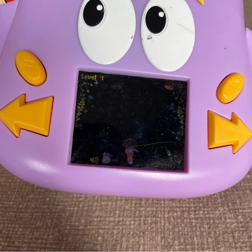 2010 technosource Dora the explorer Dora’s backpack adventure handheld LCD game